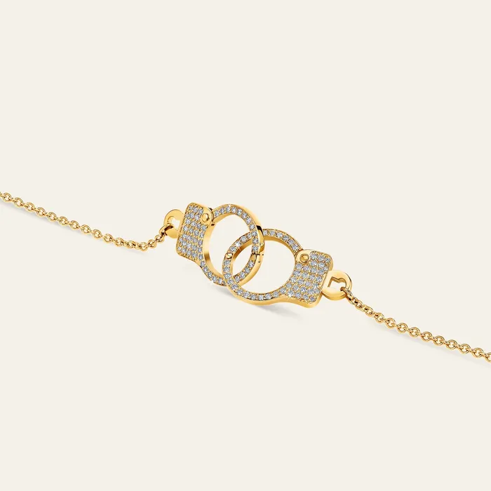Necklaces Hand crafted in 18k yellow gold and set with 100 highquality round brilliant cut diamonds Love Lockdown Interlocking Diamond Necklace